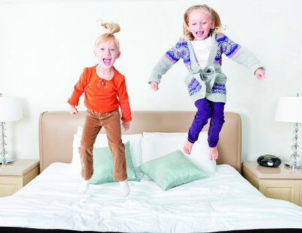 Kids jumping on the bed